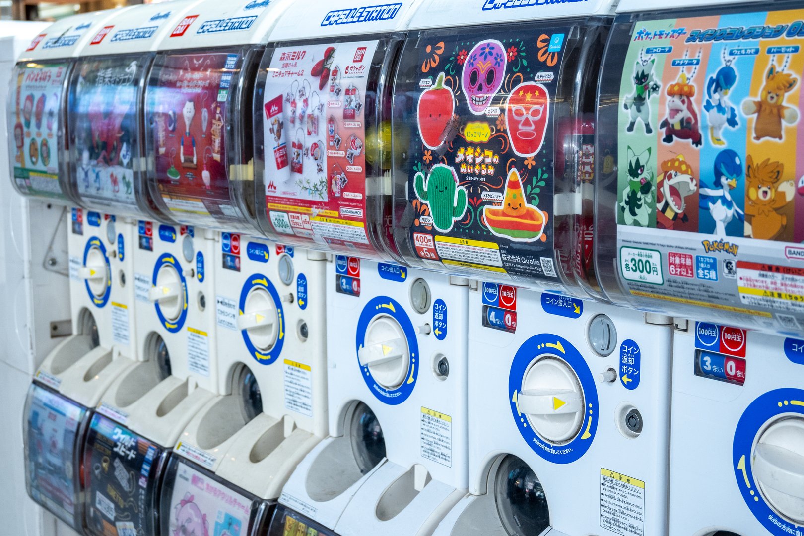 Tokyo, Japan, 09 25 2024: Gashapon vending machines, filled with colorful toys and collectibles, stand in a row, ready to dispense fun surprises