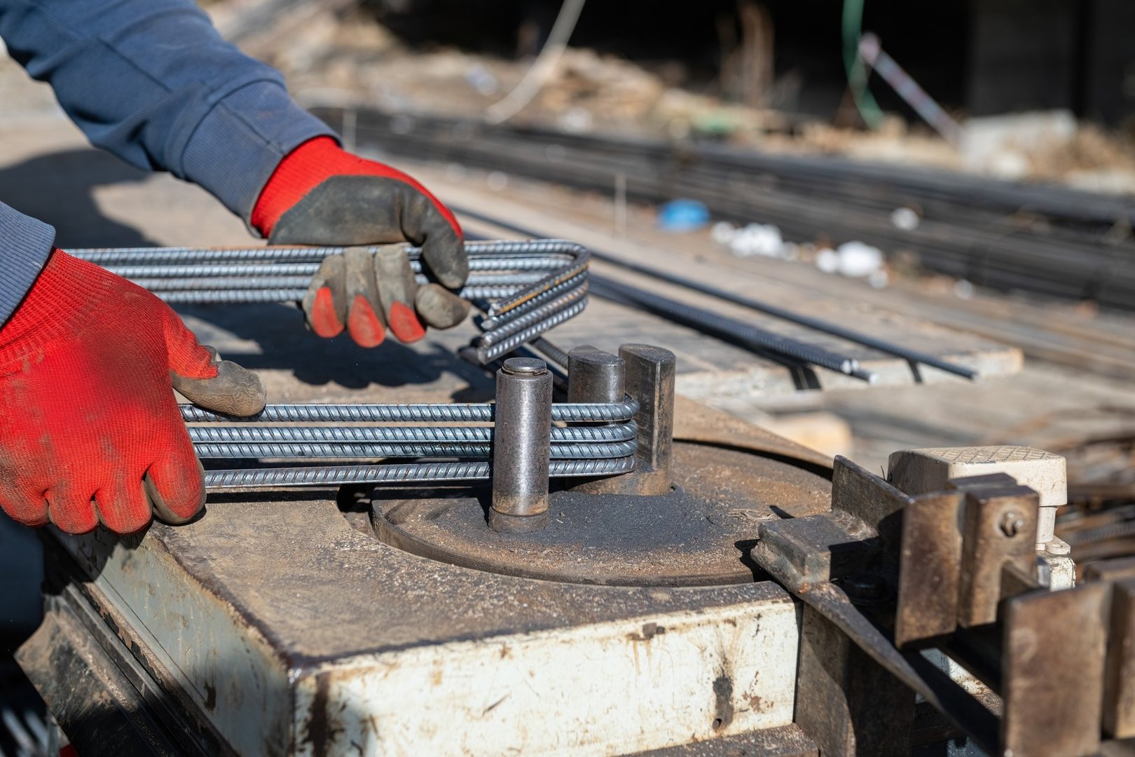Ironworker preparing various sizes of iron for building construction.