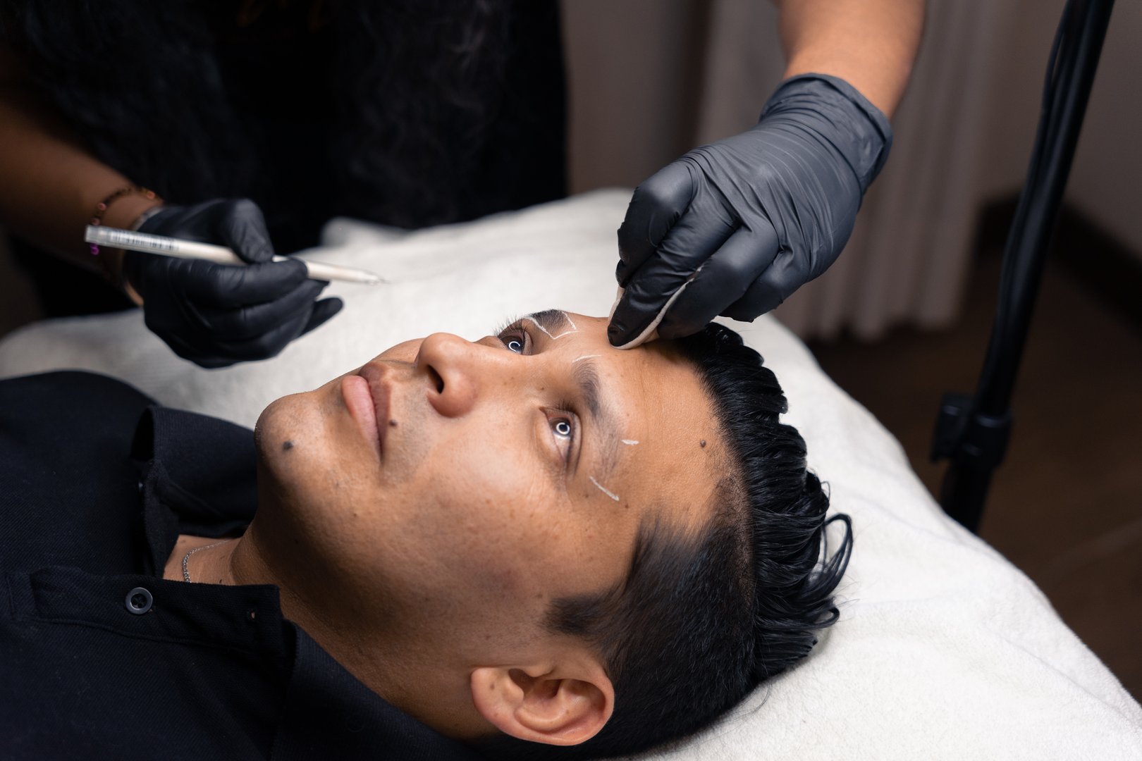 micro pigmentation technique on a latin man's eyebrows