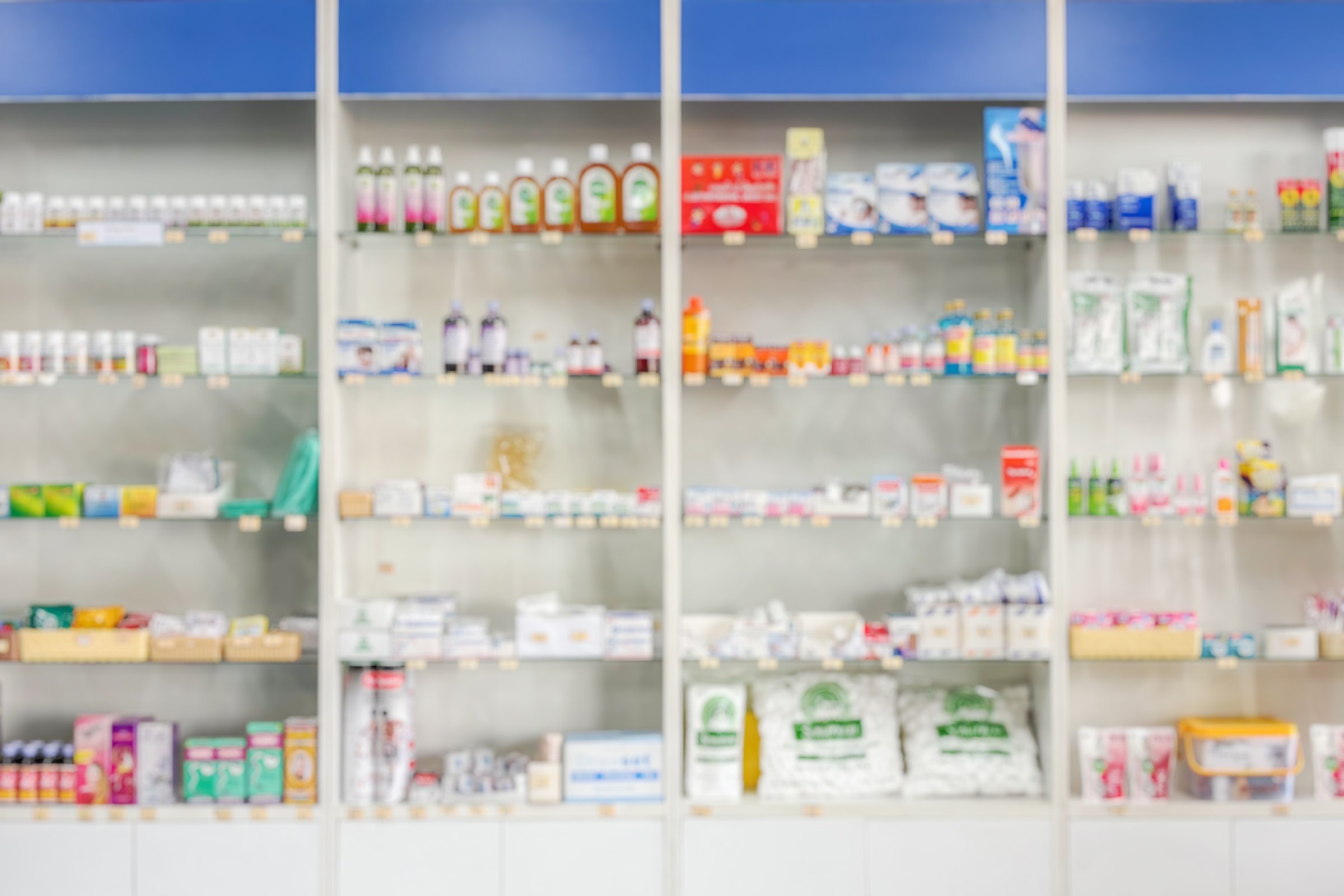 Pharmacy drugstore shelves interior blur medical background