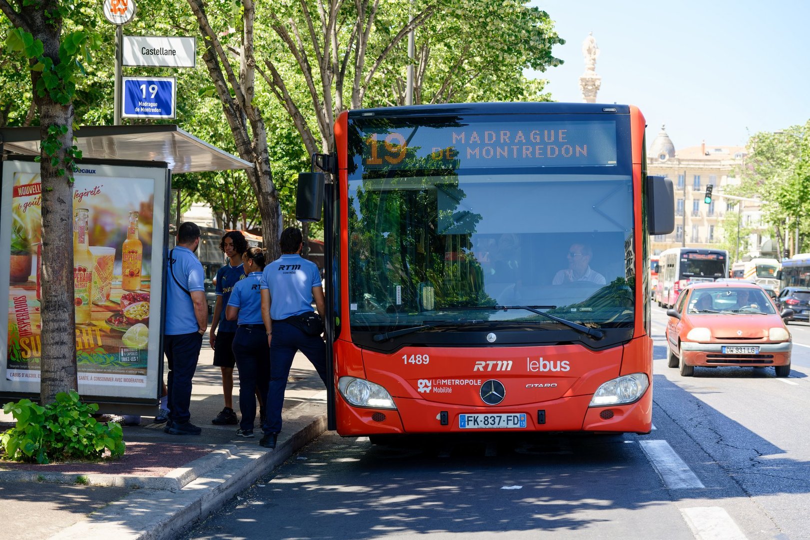 Marseille, France, 05 30 2025 : Public bus 19 at Castellane stop, Marseille, Castellane, France. Urban scene with RTM staff and city traffic, summer sunlight, typical southern architecture and vibrant street life
