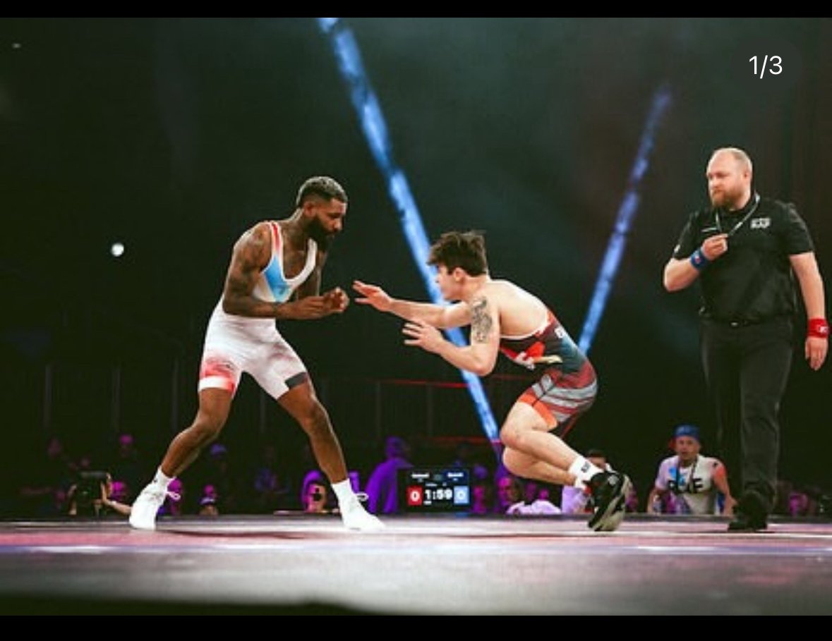 Coach Sean Kirtz training wrestlers at the academy
