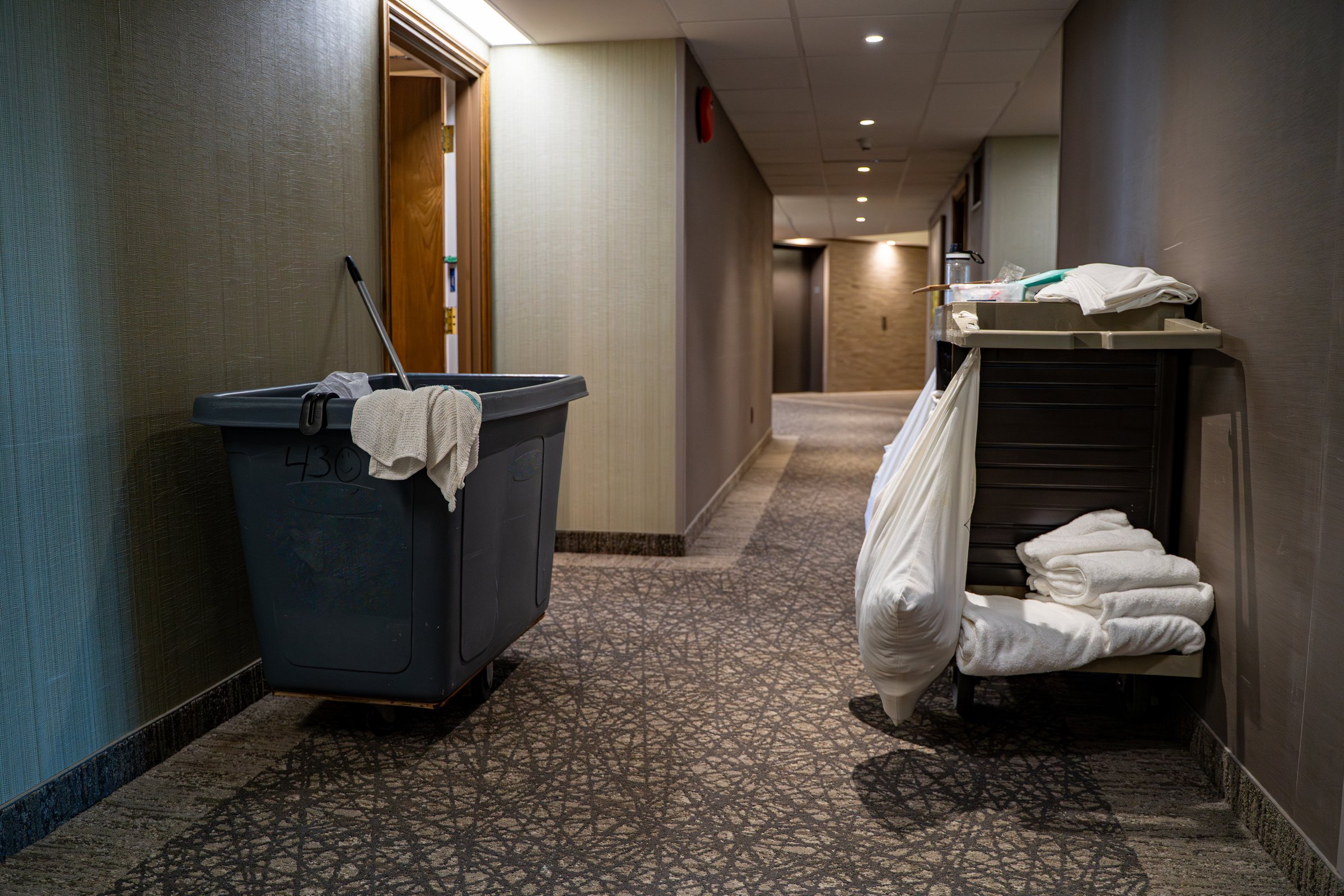 Hotel hallway with housekeeping cart