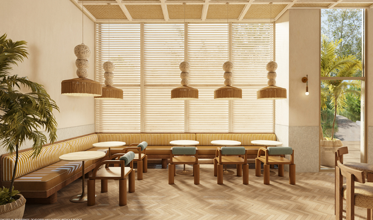 A modern cafe interior with round tables, cushioned chairs, palm decor, and natural light filtering through blinds.