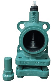 Green industrial valve with a cylindrical cap beside it, featuring flanges for mounting and markings on the surface.
