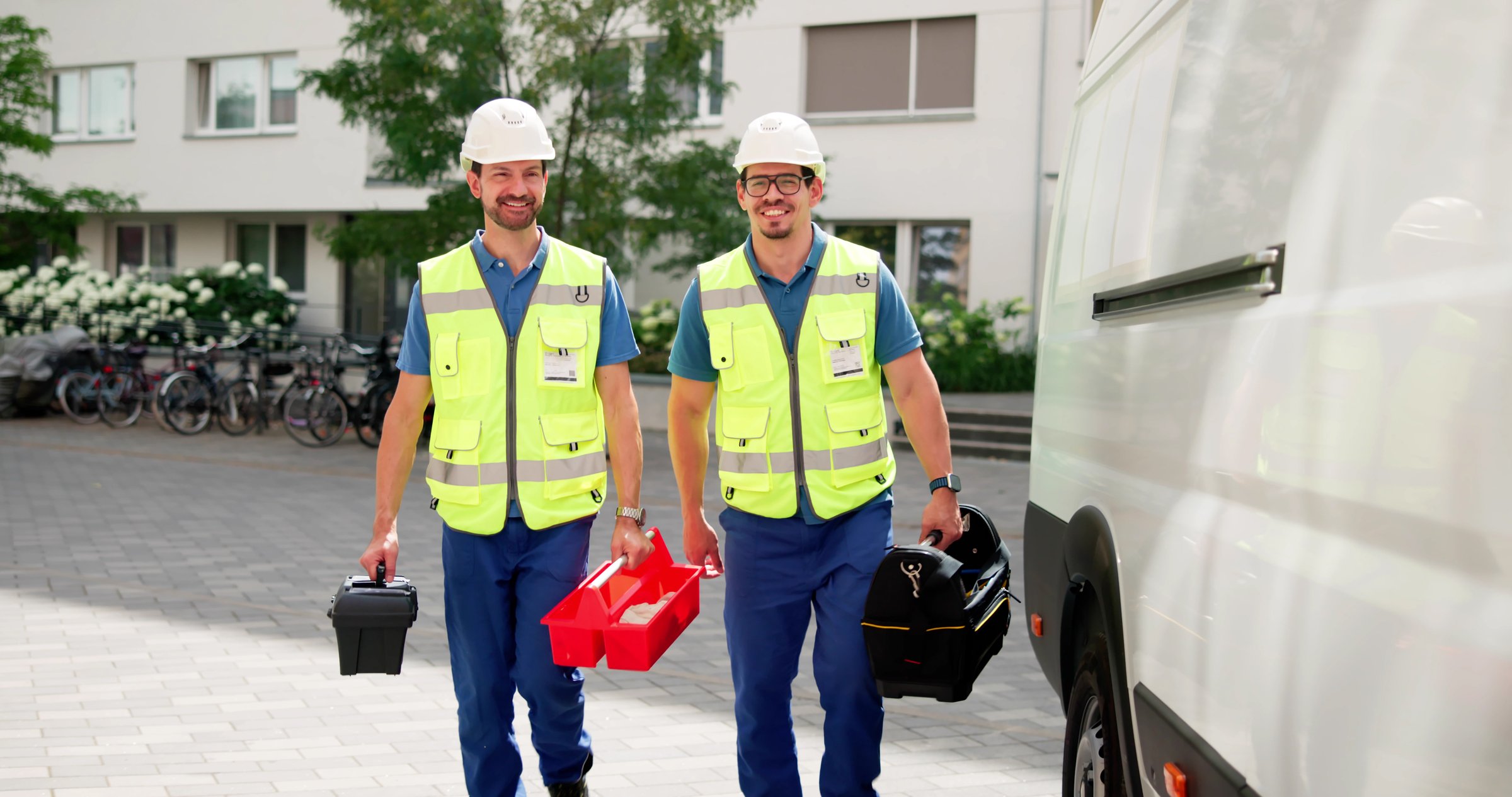 Skilled Workers On Duty, HVAC Electrician And Plumber Near Van.