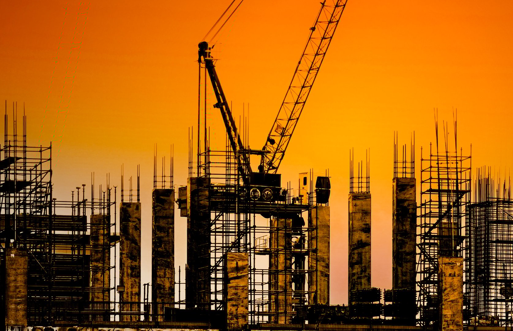 Silhouette Building Construction with cranes are working in the construction site, Construction for background.