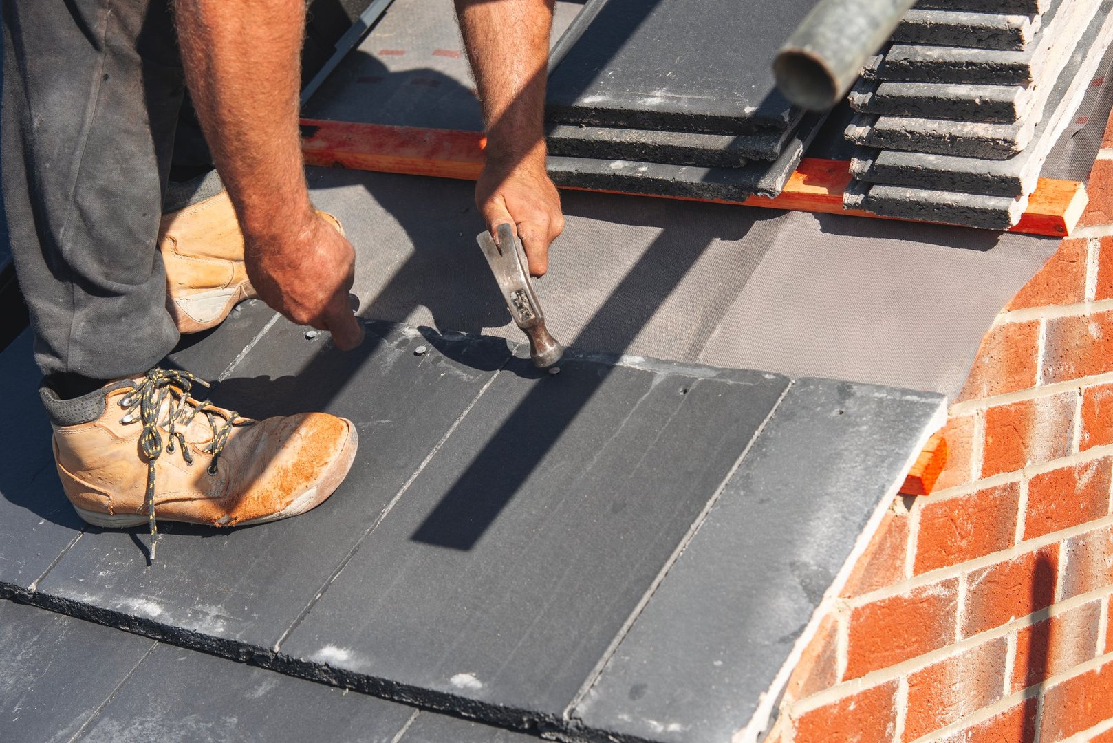 Expert roofer installing roof tiles in Burslem Stoke-on-Trent - Professional roofing contractors Staffordshire