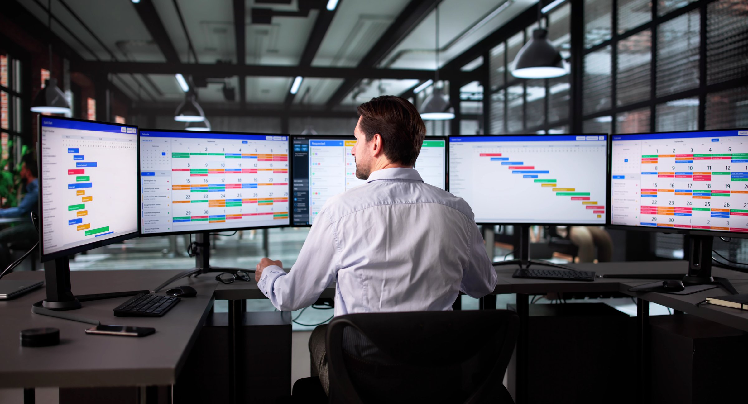 Senior Project Manager Using Scrum Software To Monitor Office Tasks