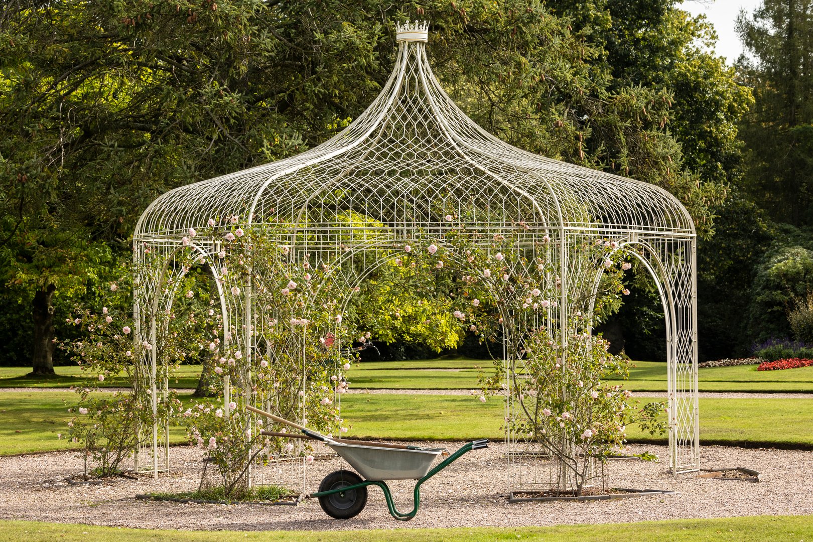 Wrought iron pergola in a park.