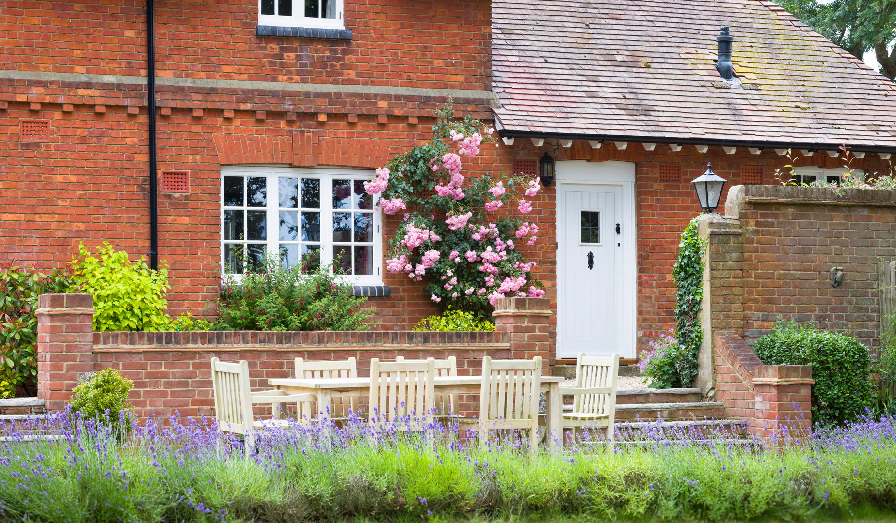 Wooden patio furniture in country garden