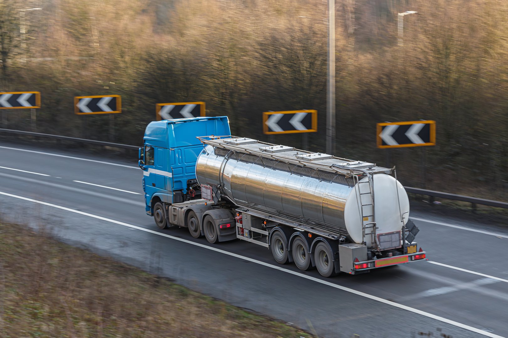 Lorry carrying liquid products traveling on the motorway.