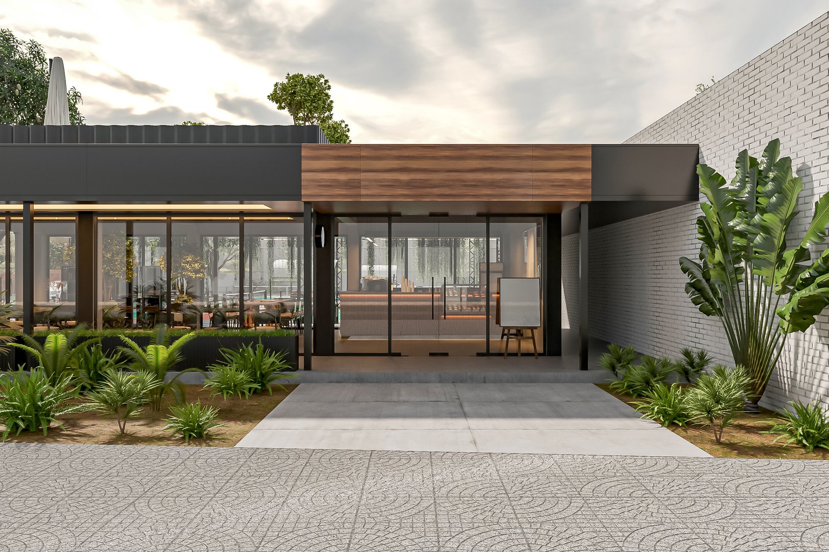 Modern Office Building Entrance with Glass Doors and Green Landscaping