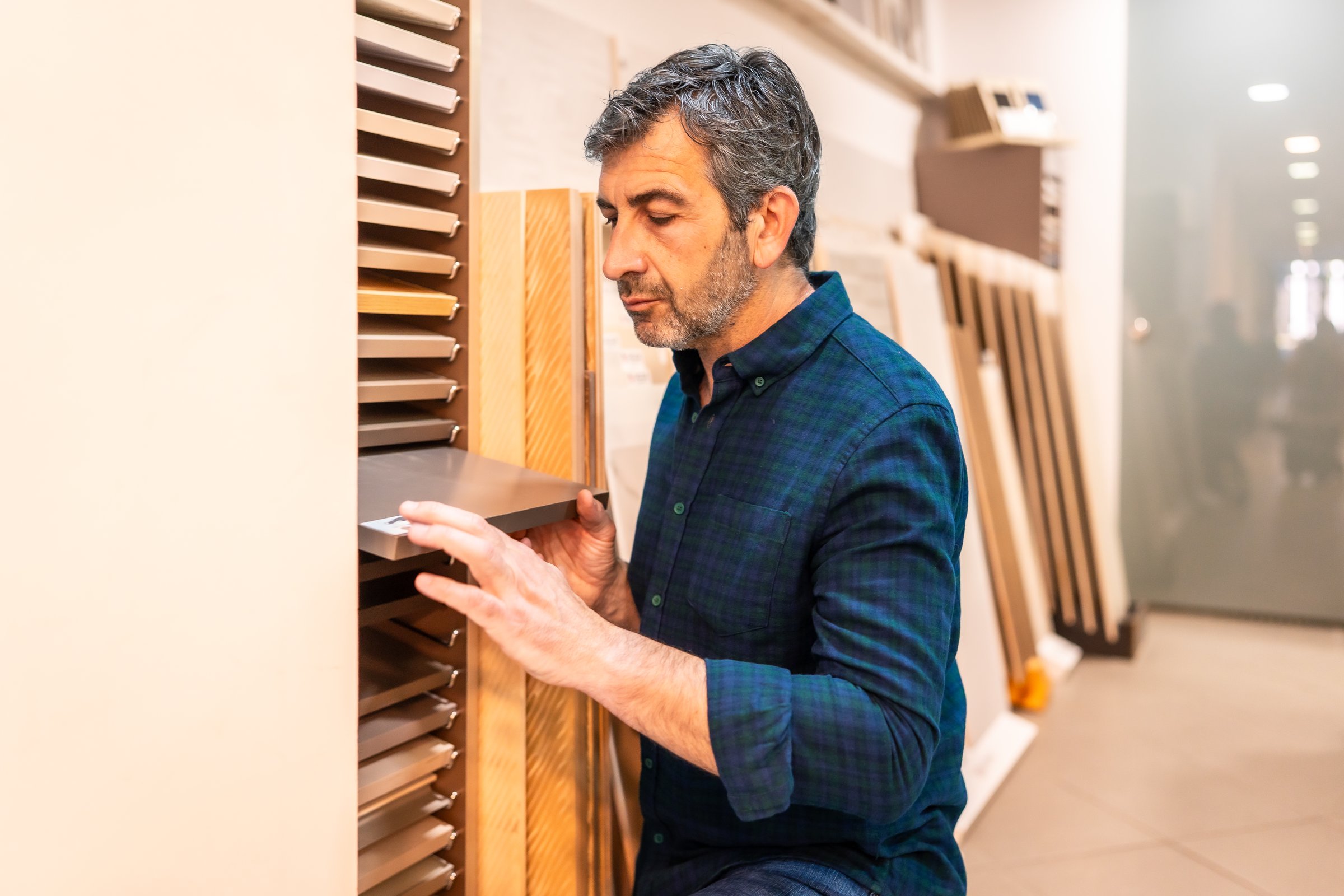 Mid adult carpenter selecting materials