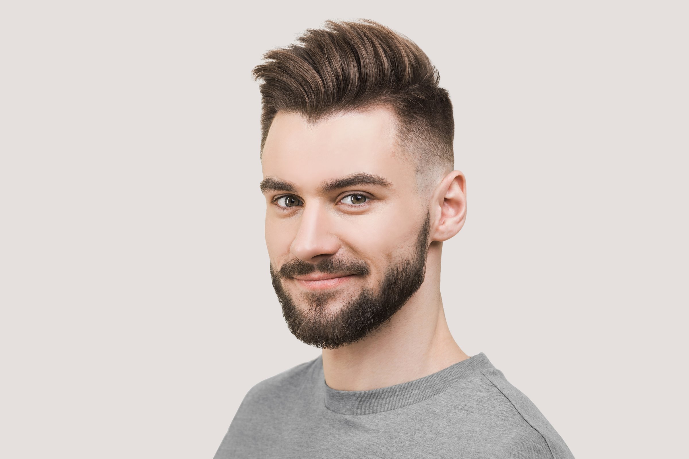 Smiling man looking at camera, isolated on white background. People, male beauty, lifestyle concept