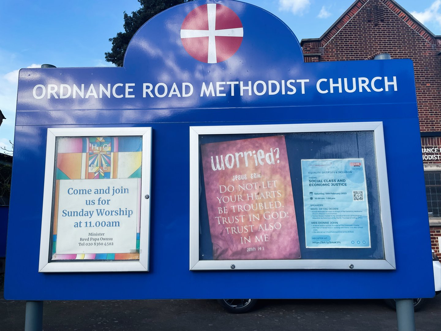 London, UK - March 02, 2025: Community notice board showcasing events and worship timings at a Methodist church.