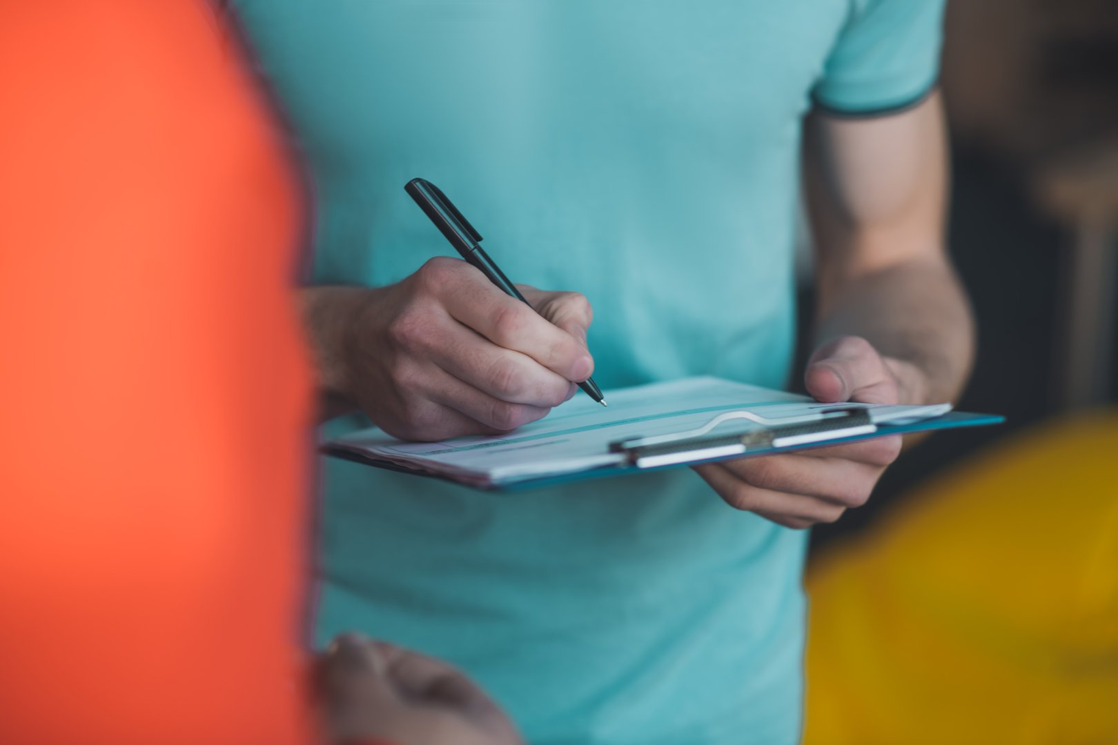 Putting a signature. Close up of a pen being in use while putting a signature in the invoice