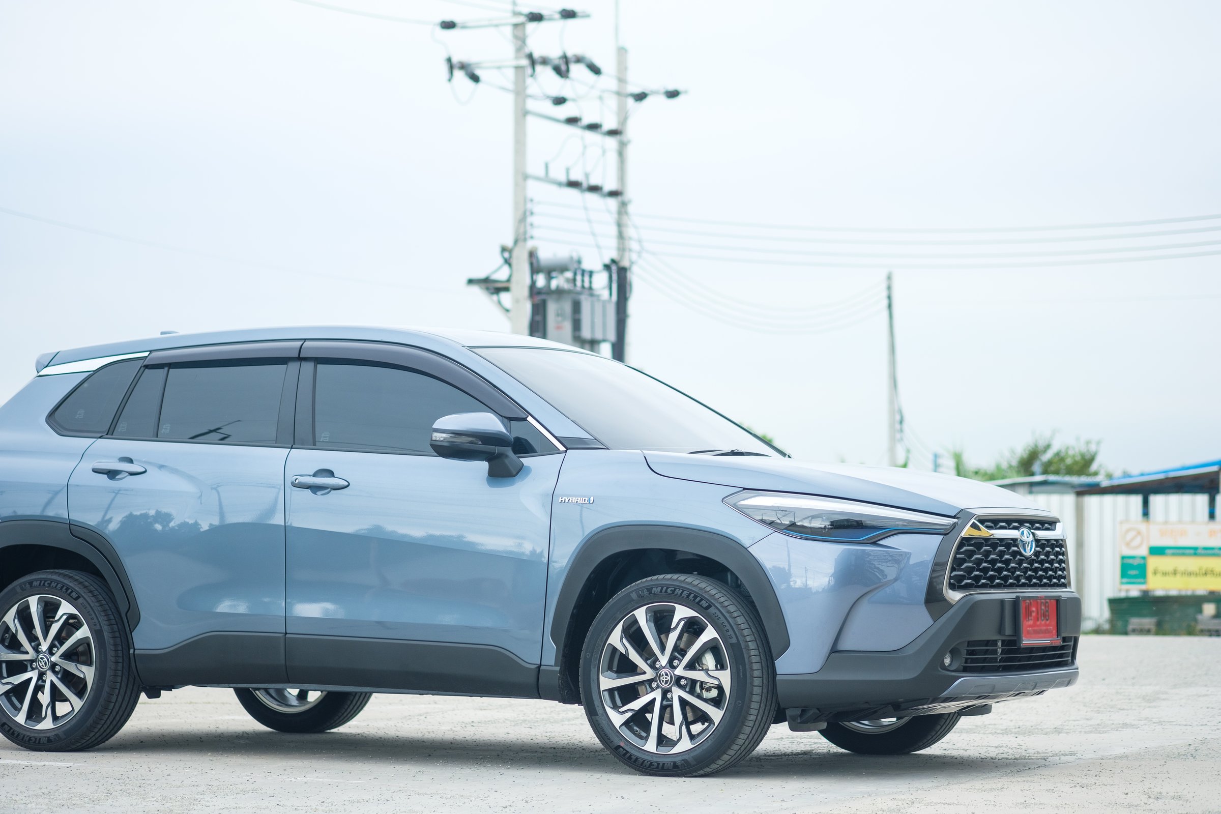 Bangkok, Thailand - MAY 14, 2022 : All-new Toyota Corolla Cross car with 1.8-liter hybrid engine. The latest Toyota's SUV. Hybrid engine 4th generation.
