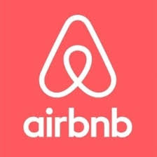 Airbnb logo with a stylized A in white on a coral background, followed by the word "airbnb" in lowercase.