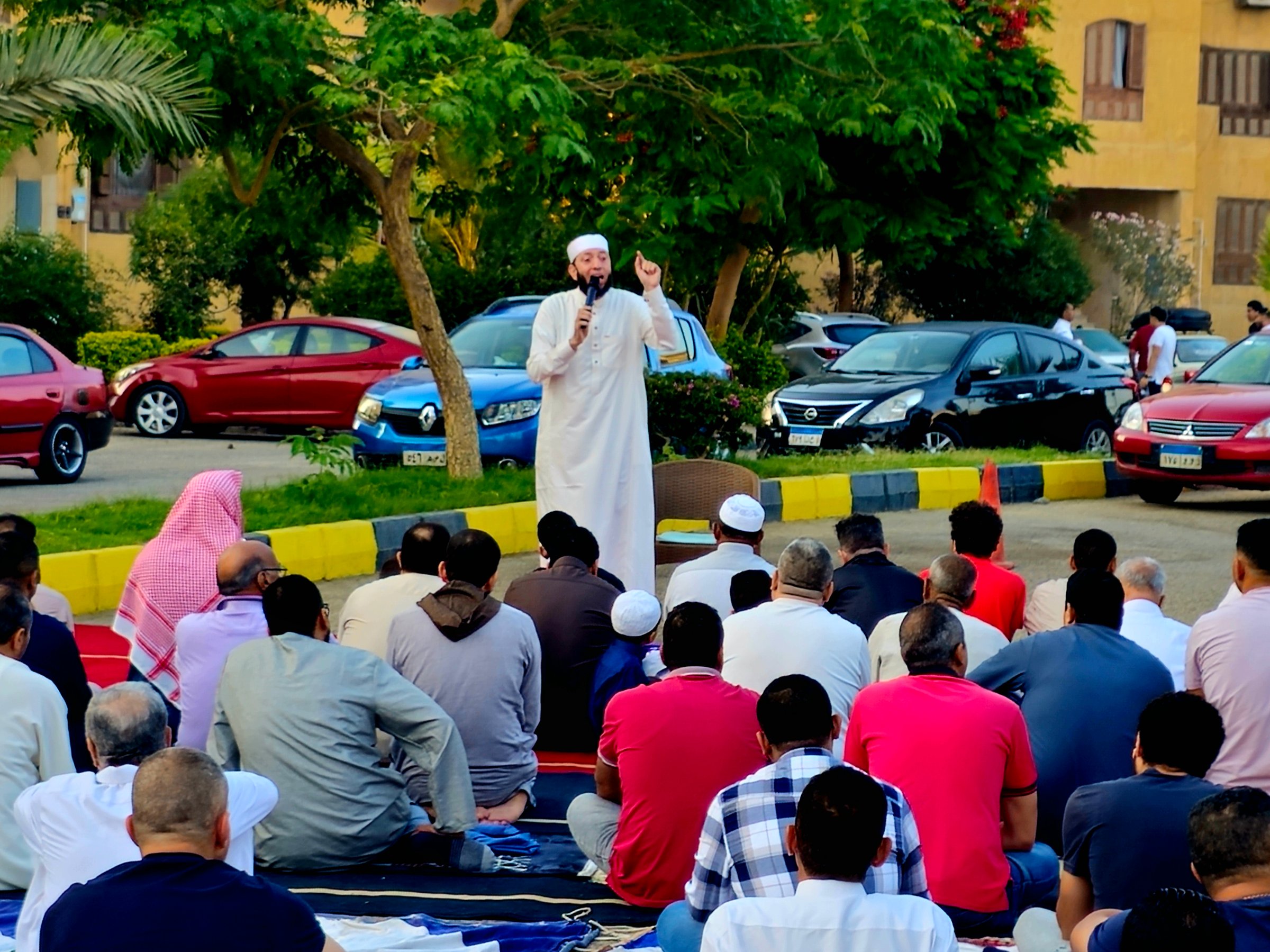 Cairo, Egypt, June 6 2025: The mosque preacher Imam performs Eid al-Adha Khutbah (sermon) in an open air space near the mosque, Islamic Feast of Sacrifice greater Eid prayer and celebration