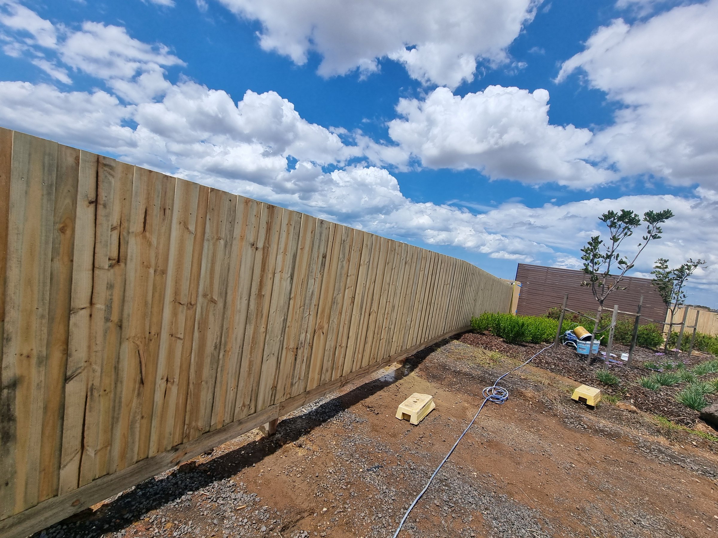 Quality Painting Group fence restoration project from November 2023 showing professional fence staining and weatherproofing work