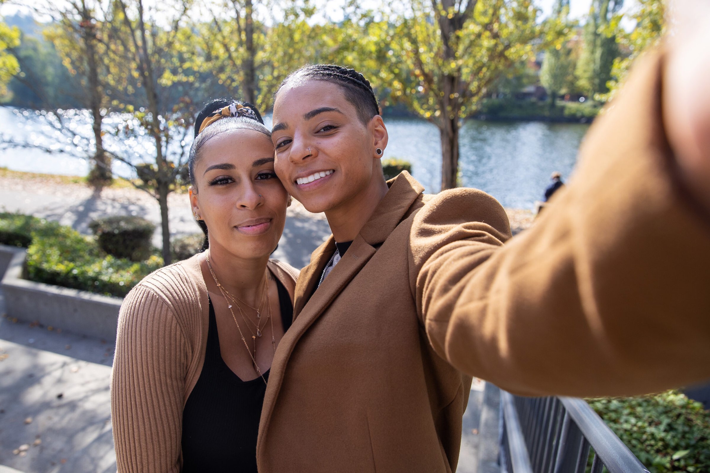 Young African American gay couple taking selfie
