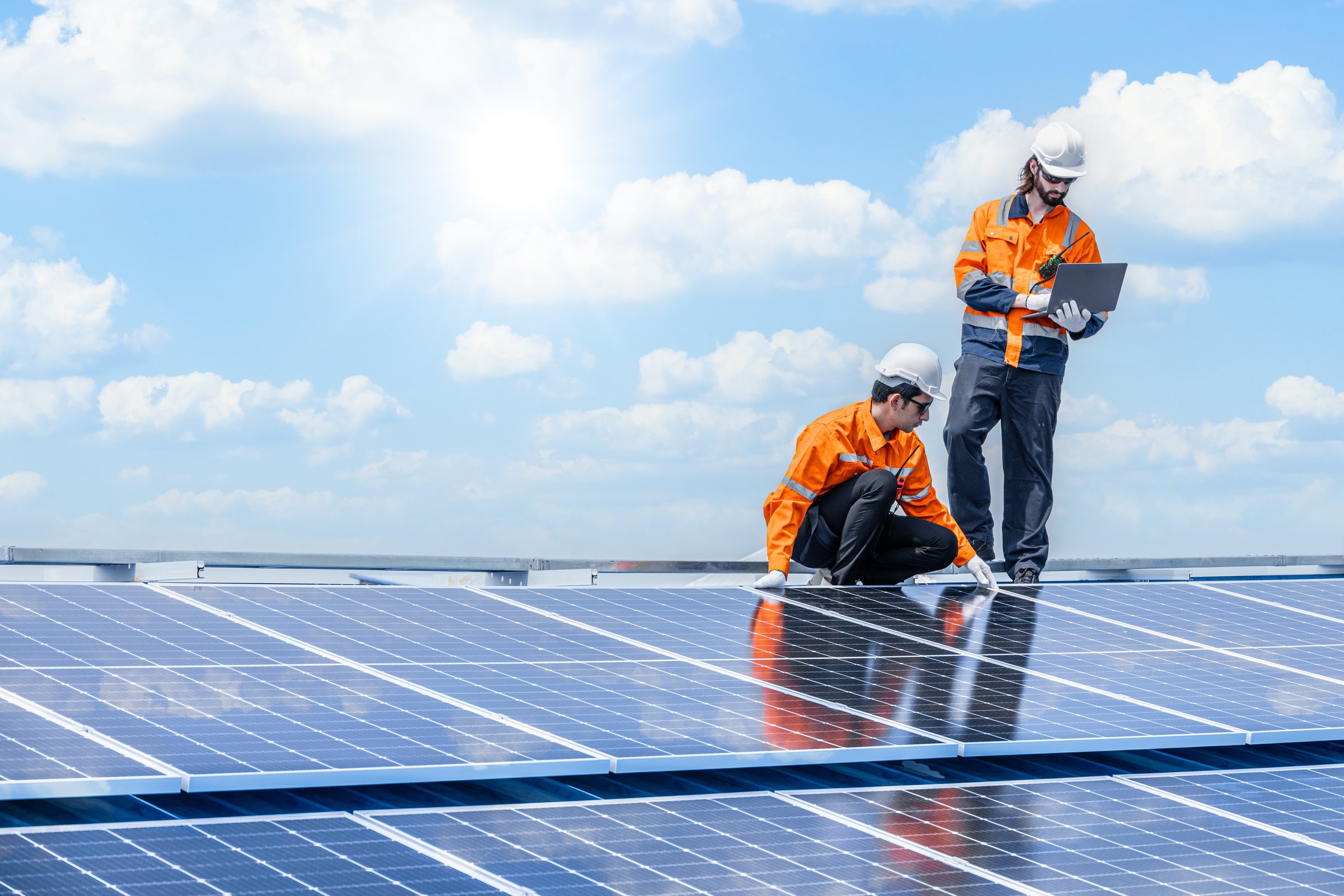 Professional Engineer Service Solar Panel. Worker Maintenance Cleaning Replacing Solar Panel. Solar photovoltaic panel system in Industry roof. Saving Energy with Clean Power.