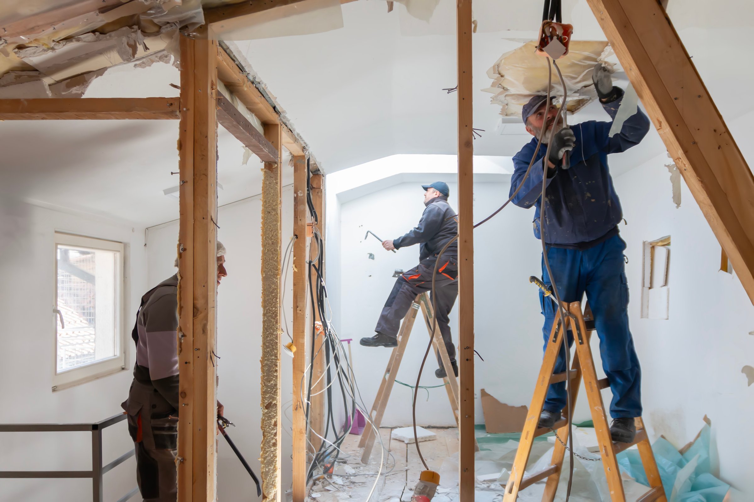 Preparation for renovation in the apartment. Home renovation workers crew. Real construction worker working on a house renovation - authentic person on the job. House improvement concept.
