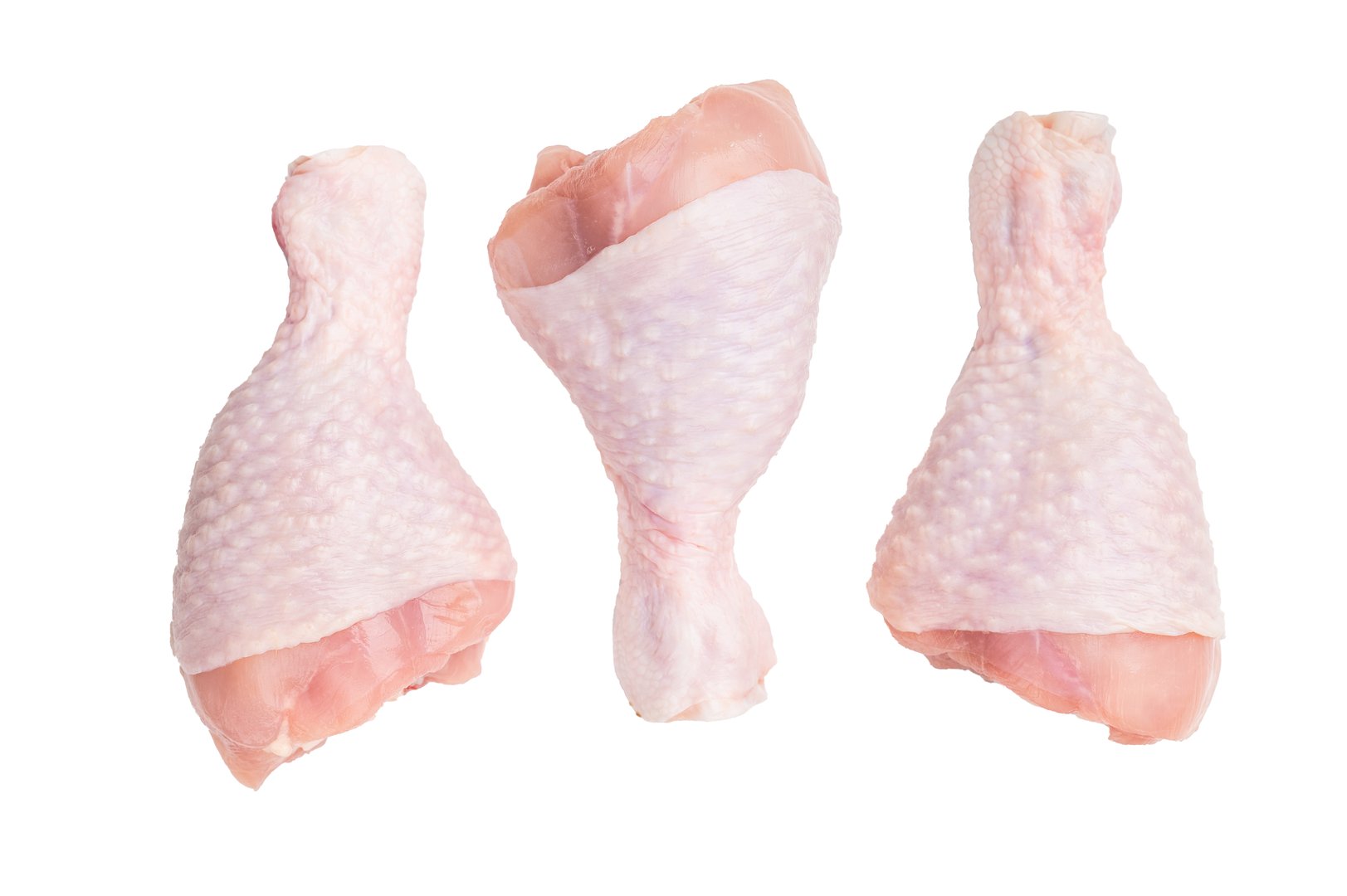 Fresh chicken drumsticks, raw poultry showcasing their rich color and tender texture, ready for marinating and grilling. isolated on white background. top view.