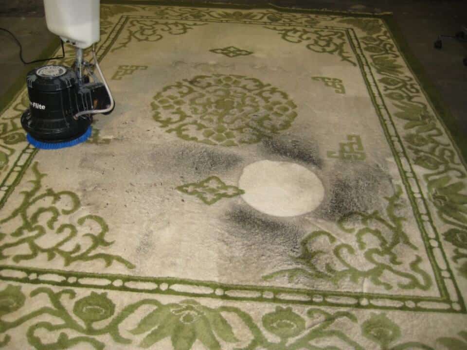 Before: Rug with stains requiring professional stain removal