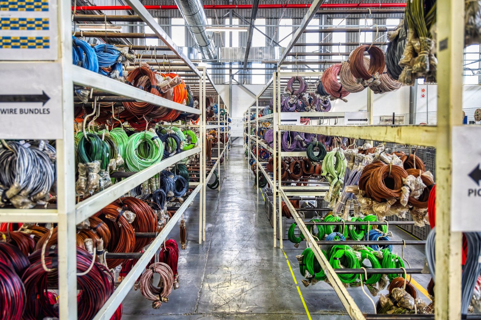 car wire harness factory, wiring cable packed on industrial shelves