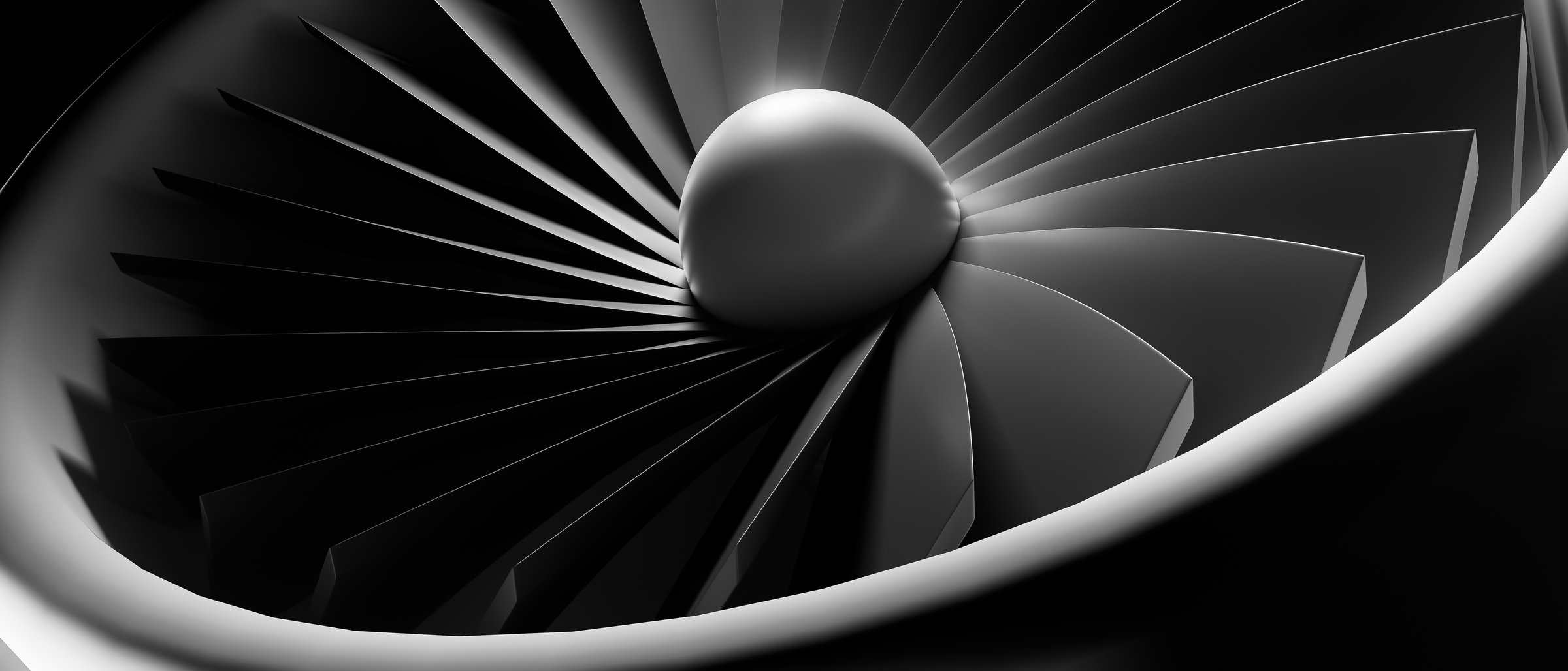 A close up of a jet engine with a black and white filter. Concept of power and speed, as well as the complexity of the engine's design. The black and white filter adds a timeless