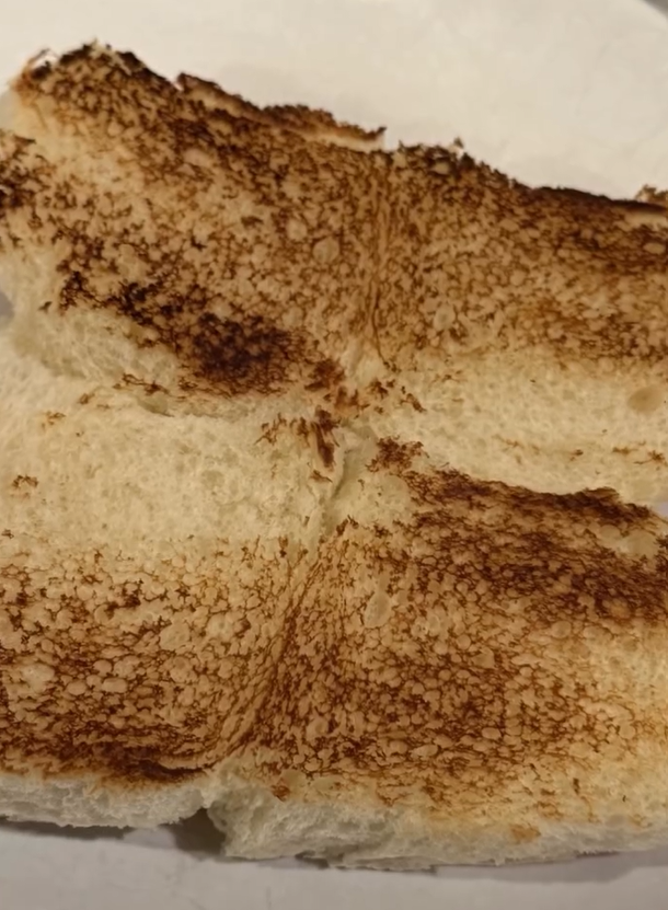 Toasting Hawaiian rolls with butter until golden