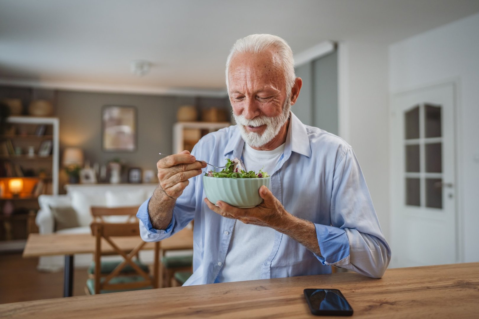 Senior man eating healthy salad