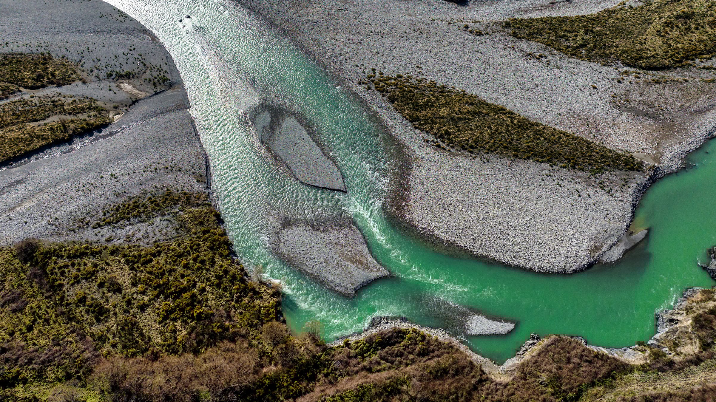 Aerial river forest and mountain scenery of the stunning road through the valley leading into the alpine Lewis Pass