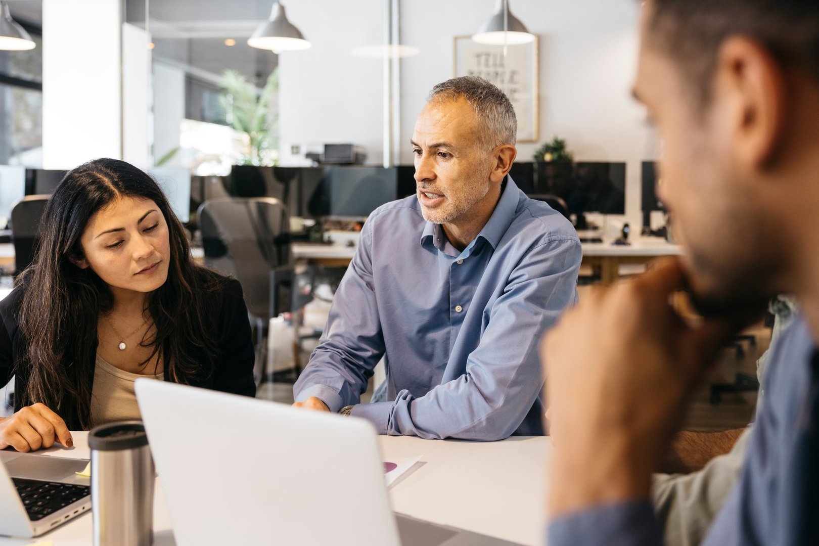 Diverse colleagues conducting a meeting in a contemporary workspace
