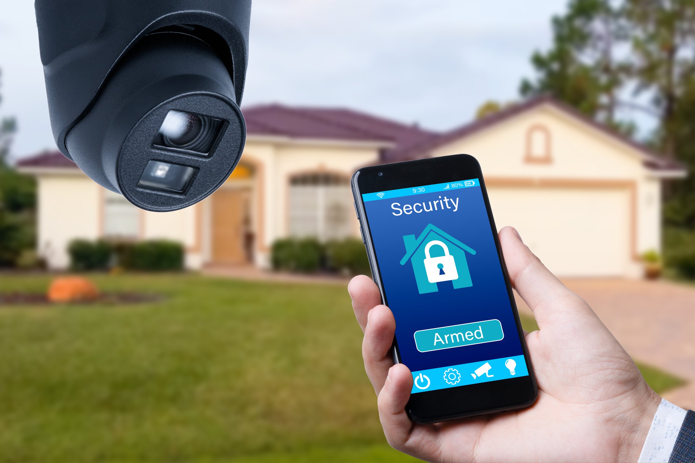 Security camera and smart home app, private house on the background