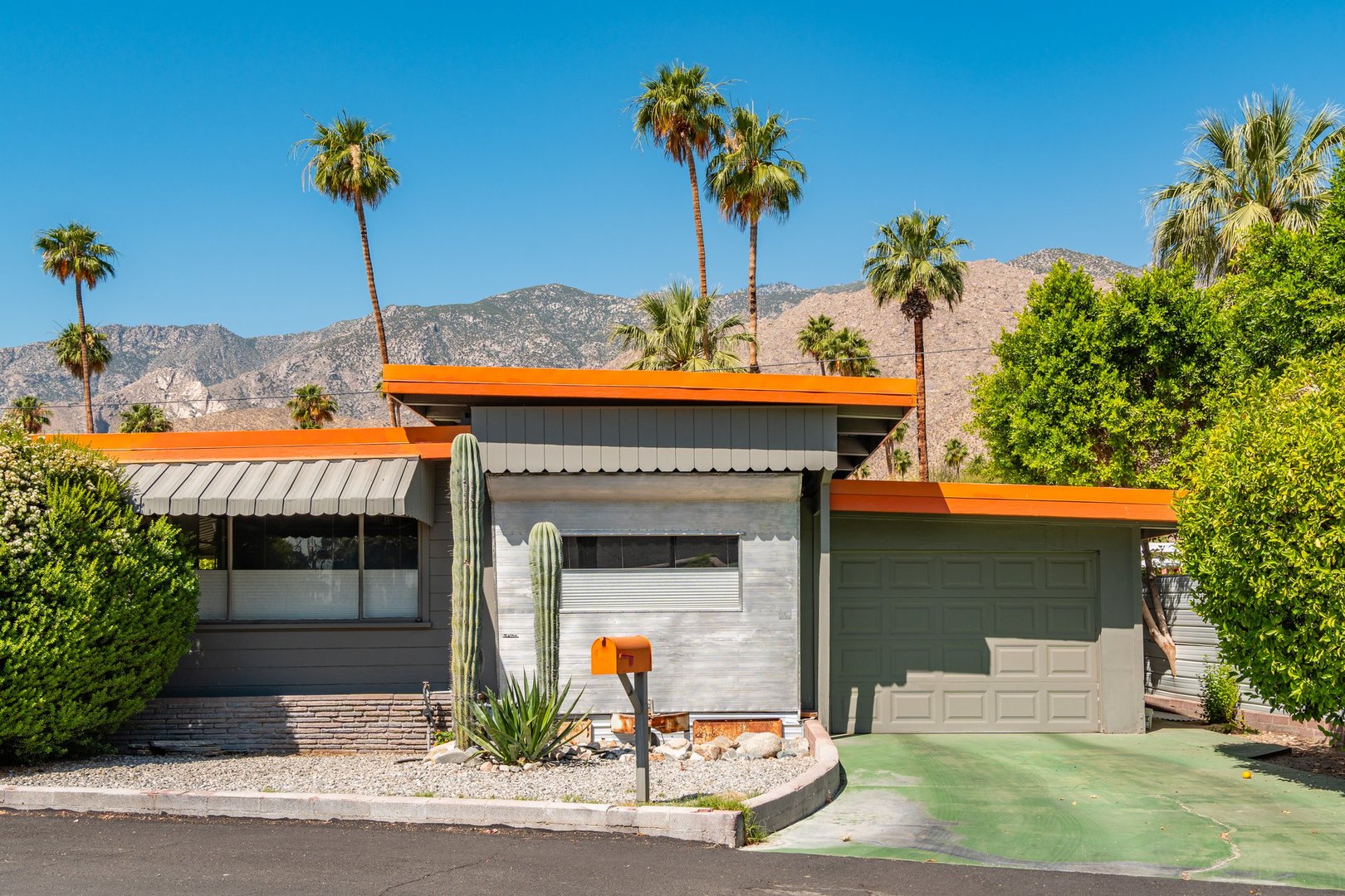 Palm Springs, CA, US-May 22, 2024: Exterior of mid-century modern luxury mobile home in suburban neighborhood.