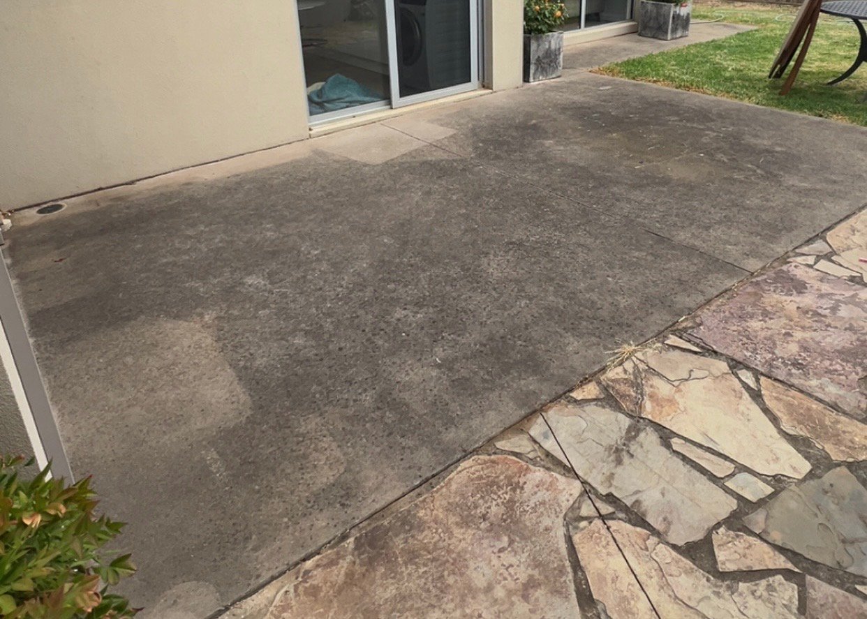 Dirty concrete surface before cleaning