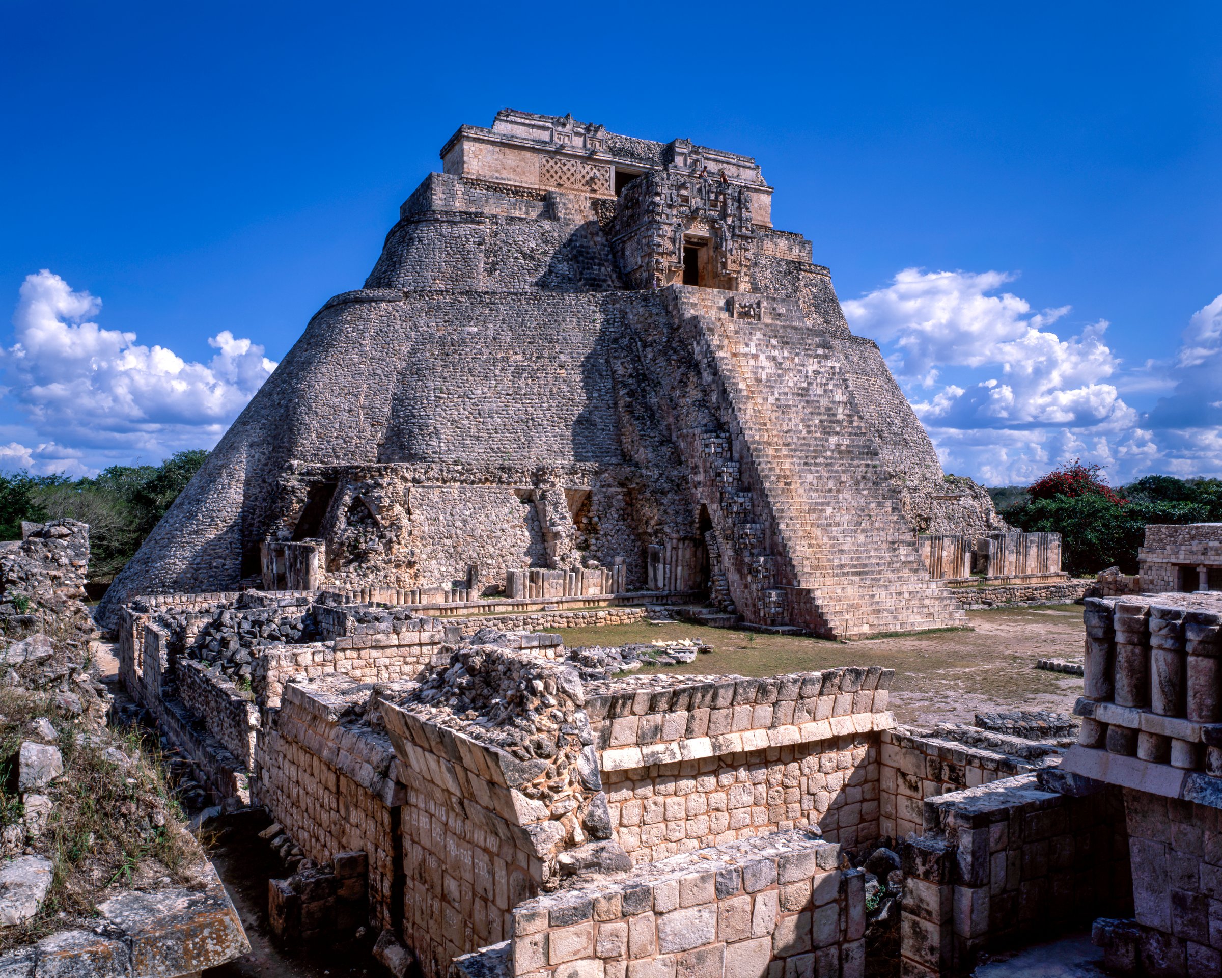 The Pyramid of the Magician, a prominent Mayan pyramid at the Uxmal archaeological site, Yucatán, Mexico, known for its unique oval base and steep sides.