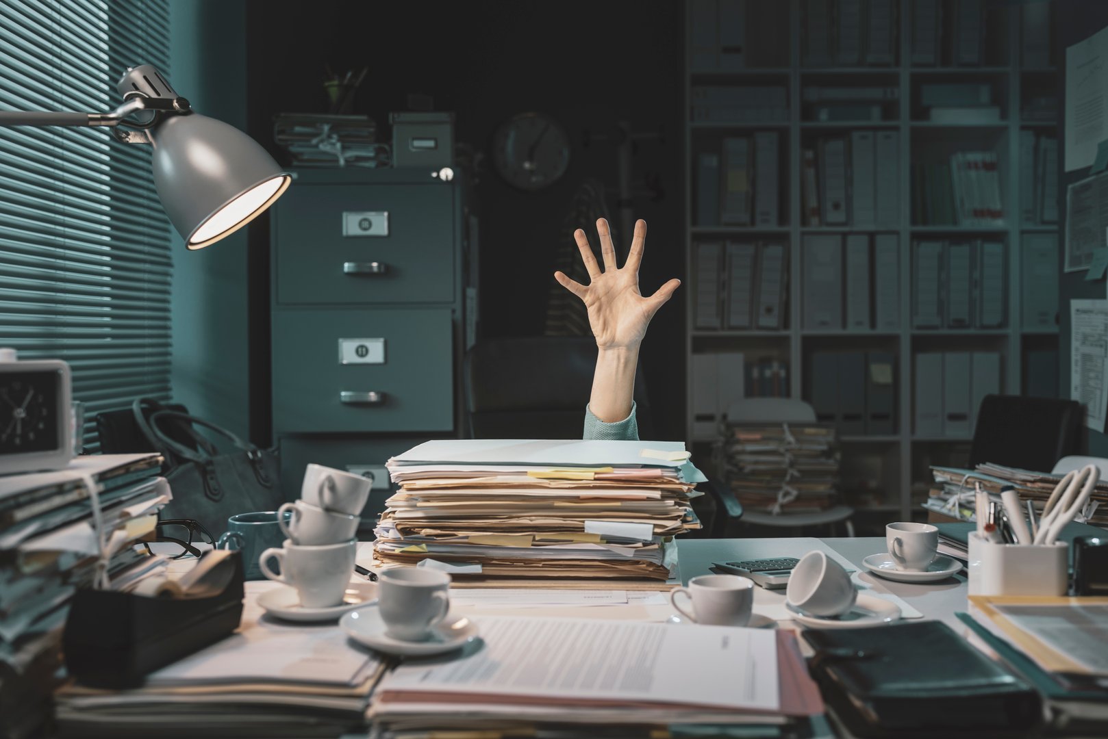 Desperate office worker overwhelmed with paperwork, she is asking help with her hand