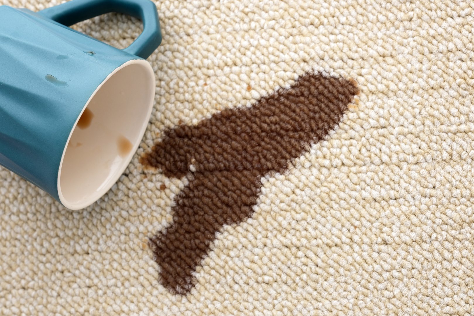 Coffee spill on light fabric surface creates a striking contrast and highlights the need for careful handling.
