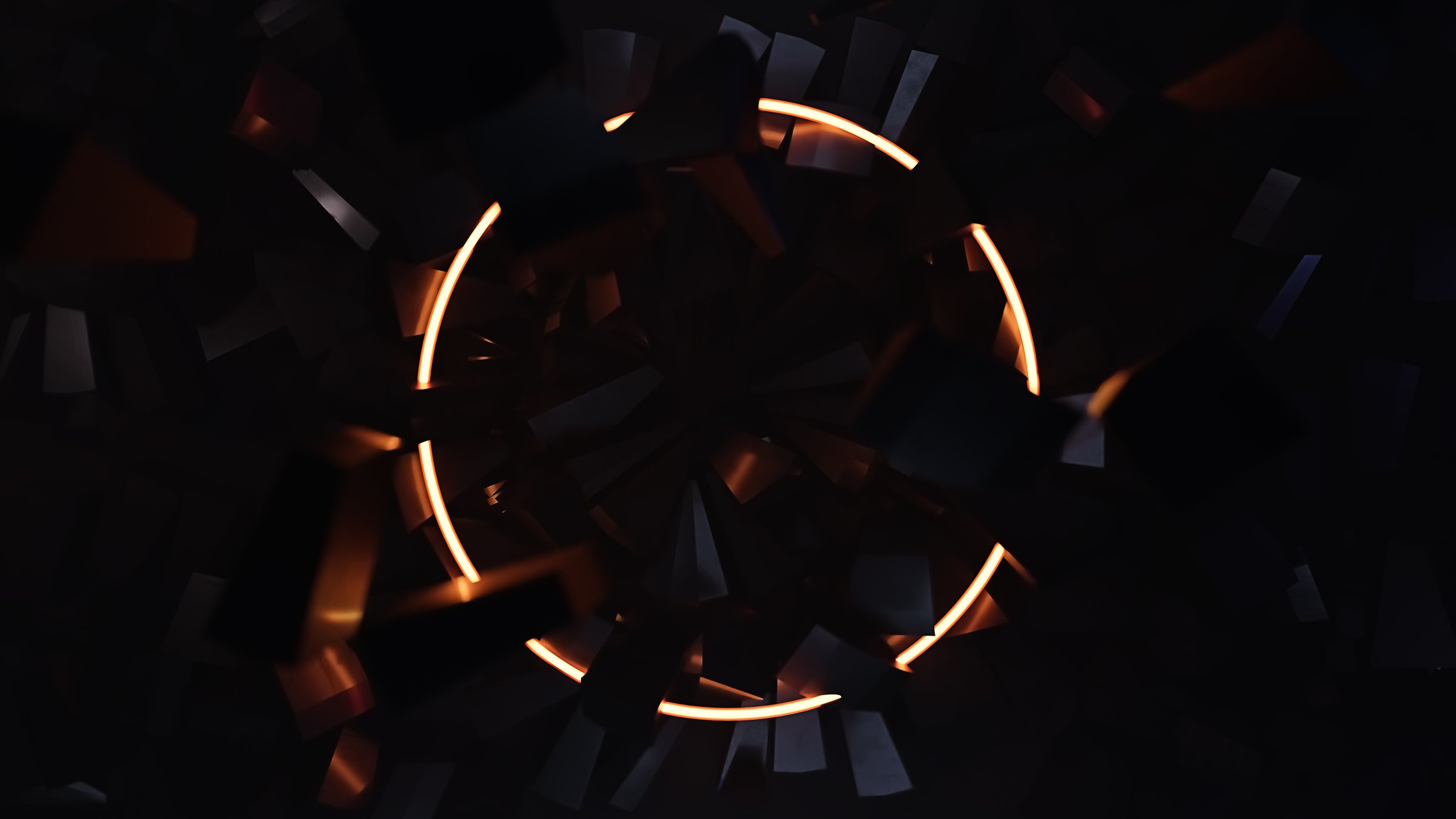 Cracks in a dark material with flying fragments and a glowing circle in the center background for a mockup