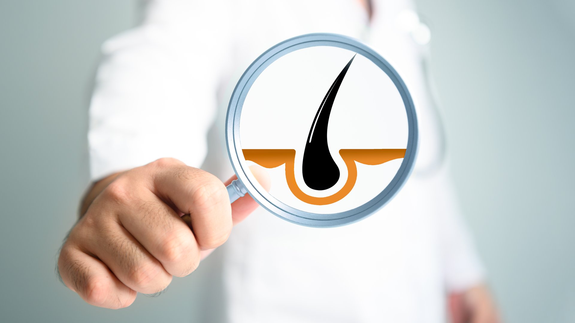 Magnifying glass on researcher hand with hair pores background. Medical lifestyle and healthcare concept. Dermatologist and doctor theme.