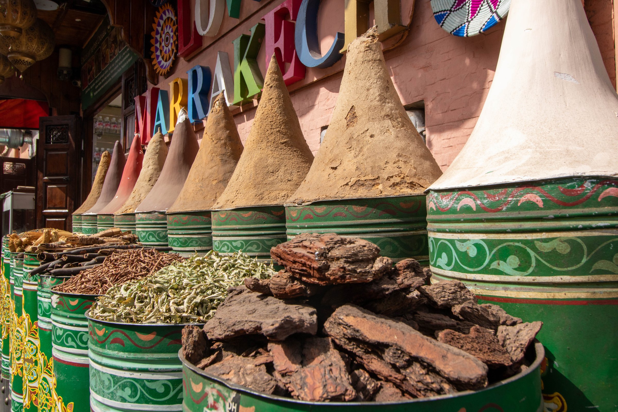 Colorful pigments and dried herbs shop in the Medina of Marrakech Morocco
