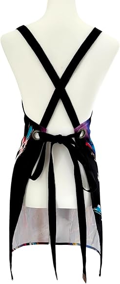 Back of a mannequin wearing an apron with cross-back straps and a colorful abstract pattern.