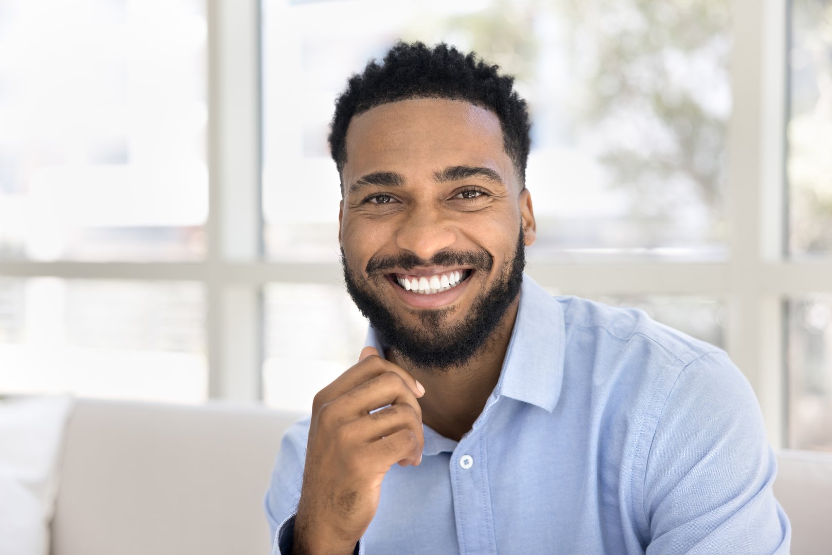 Happy Black man with confident smile after cosmetic treatment