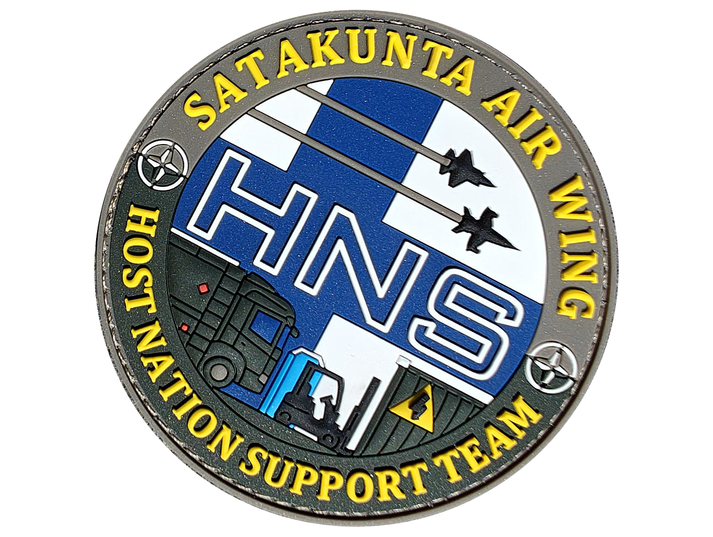 Emblem of Satakunta Air Wing HNS Team featuring jets, a truck, a forklift, and Finnish flag elements.