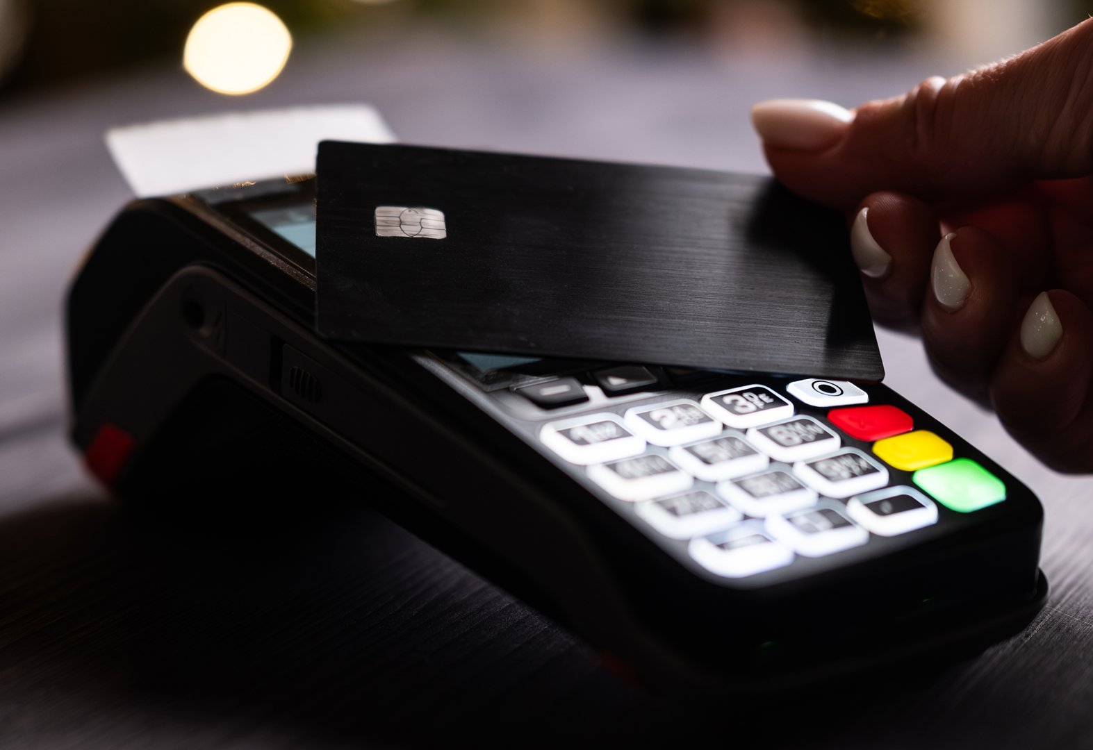 Close-Up View Of A Girl Paying By Credit Card With A Wireless Pos Terminal