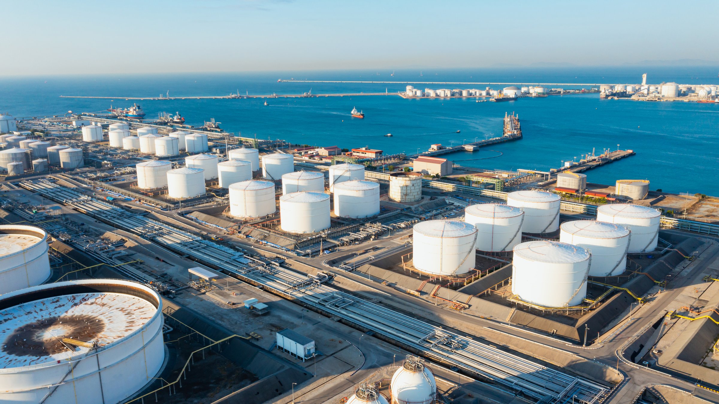 Aerial view or oil terminal is industrial facility for storage tank of oil and LPG Petrochemical. oil manufacturing products ready for transport and business transportation, LPG Tank, CNG tank